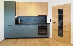 a kitchen with a sink and a stove at Landhaus Altweck in Wegscheid