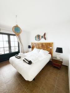 Ένα ή περισσότερα κρεβάτια σε δωμάτιο στο Casa Lava