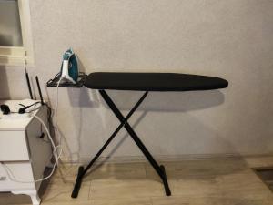 a black desk with a phone on a wall at Mahmud Hostel in Sheki