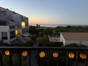 a view from a balcony of a building and the ocean at Le Panorama du Tropique Saint Cyprien - Saint-Cyprien-Plage - Perpignan 66 Vue mer - Front de mer in Saint-Cyprien +82 photos