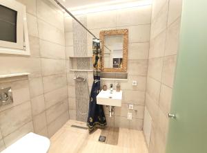 a bathroom with a sink and a mirror at SEAL of Deer - Castle View - 5 minute walk to the Beach in Rhodes Town
