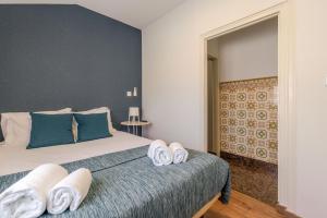 Postel nebo postele na pokoji v ubytování Petit Suites by PCALE