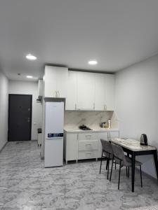 Kuchyň nebo kuchyňský kout v ubytování Apartment in New Boulevard + 2 fotografie