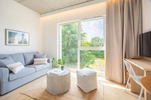 TV a/nebo společenská místnost v ubytování Babel Community Hôtel Lille - Villeneuve d'Ascq