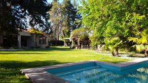 a swimming pool in the yard of a house at Angelo di Caneva in Chacras de Coria