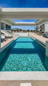 a swimming pool in the middle of a building at SOL Luxus Studio in Kallithea Halkidikis