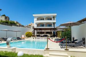 a house with a swimming pool and a building at Guest House Pasha in Ulcinj