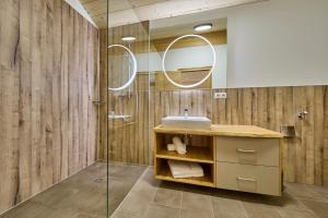 a bathroom with a sink and a shower at Bocks Apartments 53C in Wald am Arlberg