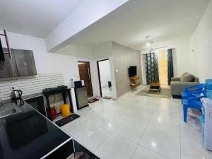 a living room with a fireplace and a couch at Kisimani Heights one bedrrom with two beds in Mombasa +9 photos