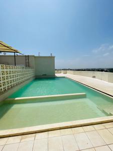 a swimming pool on the roof of a building at Kisimani Heights one bedrrom with two beds in Mombasa