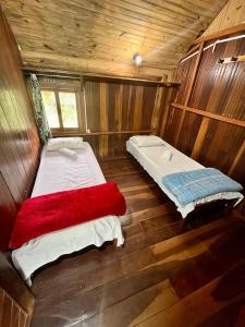 Postelja oz. postelje v sobi nastanitve Hostel Chápada Dos Veadeiros