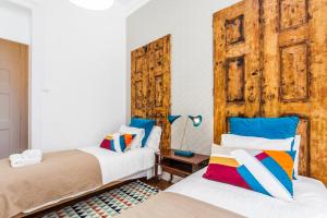 Postel nebo postele na pokoji v ubytování Lisbon Guests Apartments