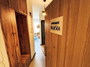 a hallway with a sign that reads ancient brasilia on a door at Apartment Gąski by Interhome in Gąski
