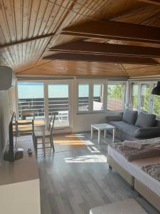 a living room with a couch and a table at Beach Resident in Balatonszemes