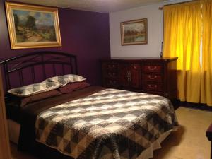 Ένα ή περισσότερα κρεβάτια σε δωμάτιο στο Nisku Guest House