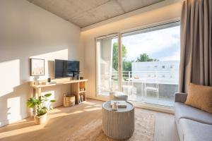 TV a/nebo společenská místnost v ubytování Babel Community Hôtel Lille - Villeneuve d'Ascq