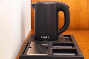 Set per la preparazione di tè e caffè presso Solis Giselle Hotel