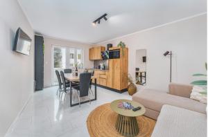 a living room with a couch and a table at SAMM Apartments Šibenik in Šibenik