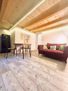 a living room with a couch and a table at Luxury LOFT in Central Cluj in Cluj-Napoca