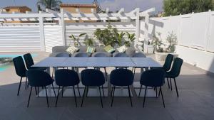 a blue table and chairs on a patio at Just Light in San Leone