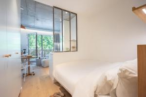 Postel nebo postele na pokoji v ubytování Babel Community Hôtel Lille - Villeneuve d'Ascq