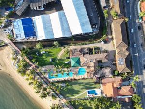 an aerial view of a resort with a swimming pool at Pousada Casa Amarela in Ilhabela