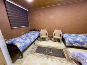 Postel nebo postele na pokoji v ubytování شاليه الريف - البحر الميت - النهضة Chalet Al-Reef - DeadSea - Al-Nahda
