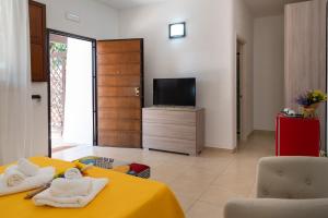 TV a/nebo společenská místnost v ubytování B&B Tenuta Barone