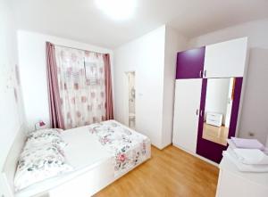 Postel nebo postele na pokoji v ubytování Apartment Eva