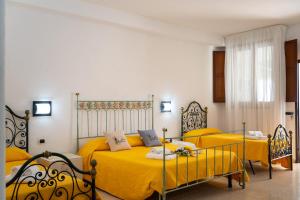 Postel nebo postele na pokoji v ubytování B&B Tenuta Barone