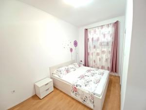Postel nebo postele na pokoji v ubytování Apartment Eva