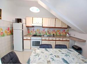 Kuchyň nebo kuchyňský kout v ubytování Apartment Eva