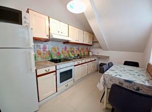 Kuchyň nebo kuchyňský kout v ubytování Apartment Eva