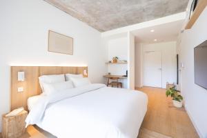 Postel nebo postele na pokoji v ubytování Babel Community Hôtel Lille - Villeneuve d'Ascq
