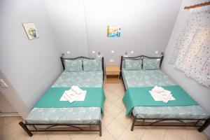 Postel nebo postele na pokoji v ubytování Babis House