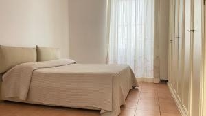 Кровать или кровати в номере Acqua e sale - Anzio centro