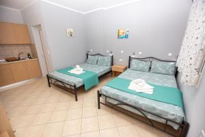 Postel nebo postele na pokoji v ubytování Babis House