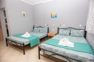 Postel nebo postele na pokoji v ubytování Babis House