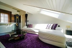 a living room with a couch and a table at GALIHOST - Ático con vistas en Cambados in Cambados