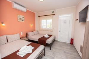Postel nebo postele na pokoji v ubytování Babis House