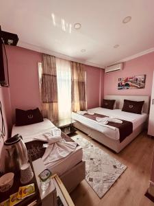 Postel nebo postele na pokoji v ubytování Laleli Palace Hotel