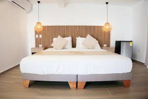 Postel nebo postele na pokoji v ubytování Mangrove Bay Hotel San Andrés Islas