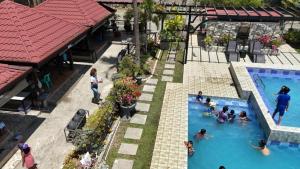 an overhead view of a pool at a resort at Balay Marino in Aritao