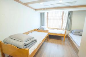 Postel nebo postele na pokoji v ubytování Cocoa Guesthouse