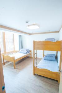 Postel nebo postele na pokoji v ubytování Cocoa Guesthouse