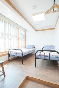Postel nebo postele na pokoji v ubytování Cocoa Guesthouse