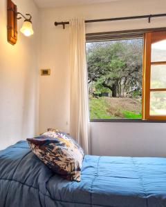 a bedroom with a pillow and a window at Harmonie Hotel De Montaña - Adults only in Villa General Belgrano +115 photos