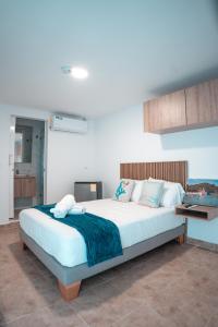 Postel nebo postele na pokoji v ubytování Mangrove Bay Hotel San Andrés Islas