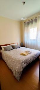 Кровать или кровати в номере Casa Praia Norte - PVZ