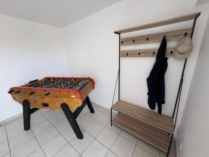 a room with a chessboard on a table next to a wall at Appartement cosy avec terrasse au calme in Urcuit +1 photo